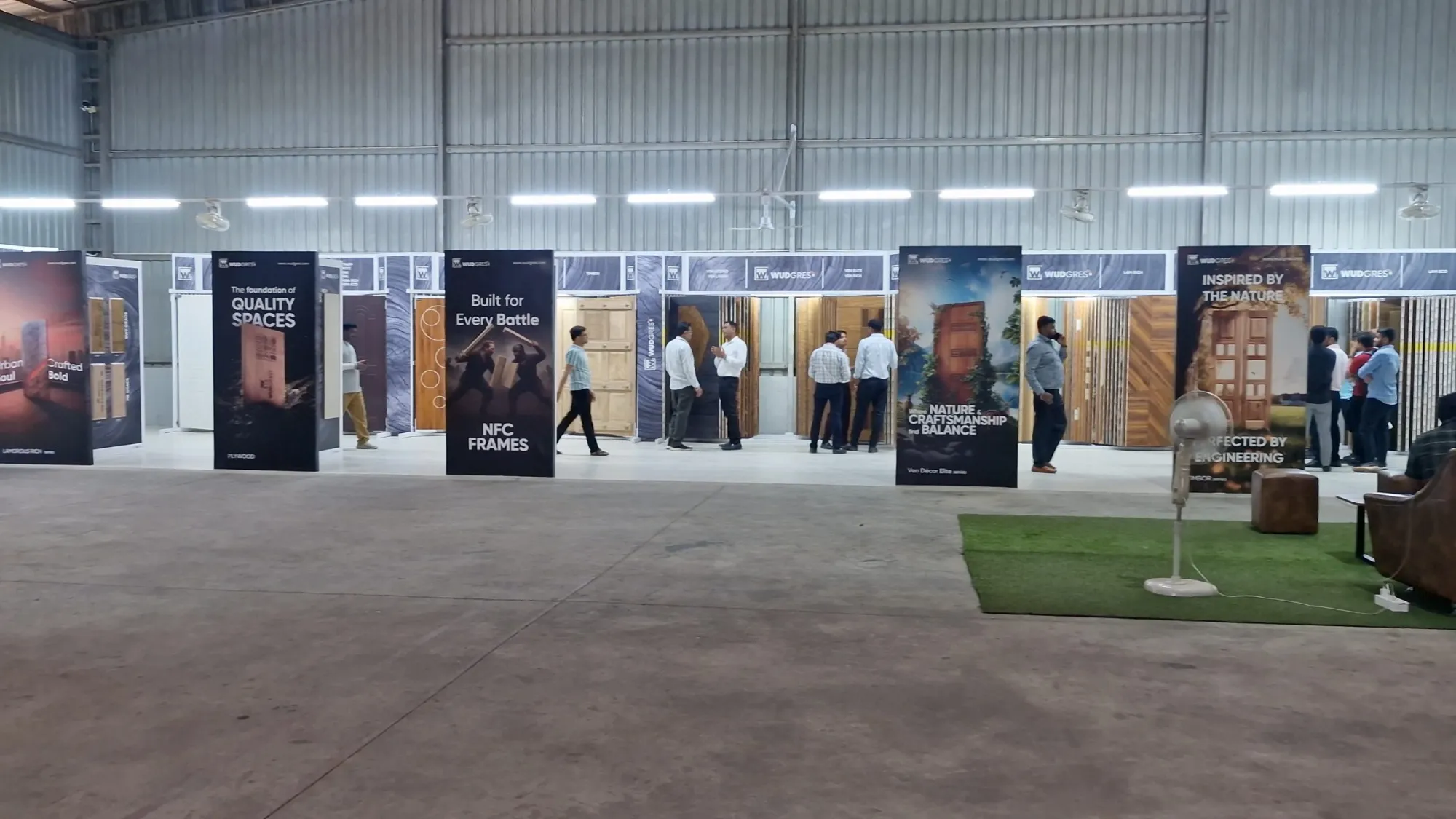 The Wudgres Experience Studio inside the factory, product standees in a long row